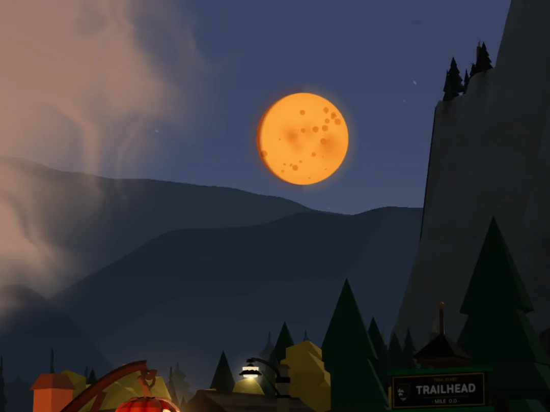 A full orange pumpkin moon in a dark blue night sky above mountains, pines and the lit trailhead of a Switchback park