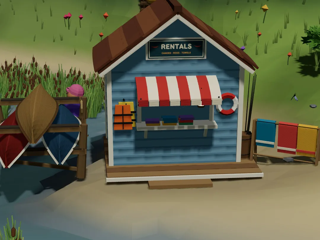 A small blue boat rental hut with a striped awning and a Rentals sign on a sandy lakeshore in Switchback, canoes stacked beside it