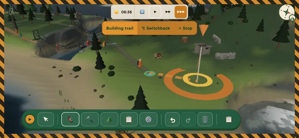 Building a trail: an orange placement ring on a green hillside, a suspension bridge over a gorge behind, and a Building trail / Switchback / Stop toolbar